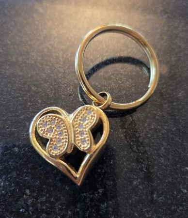 As sleutelhanger vlinder ( geelgoud kleur)