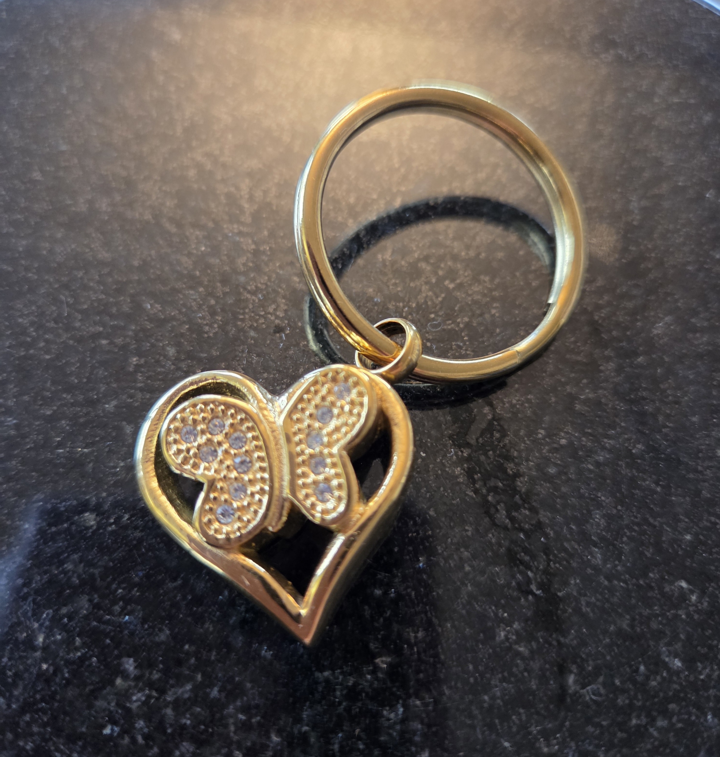 As sleutelhanger vlinder ( geelgoud kleur)